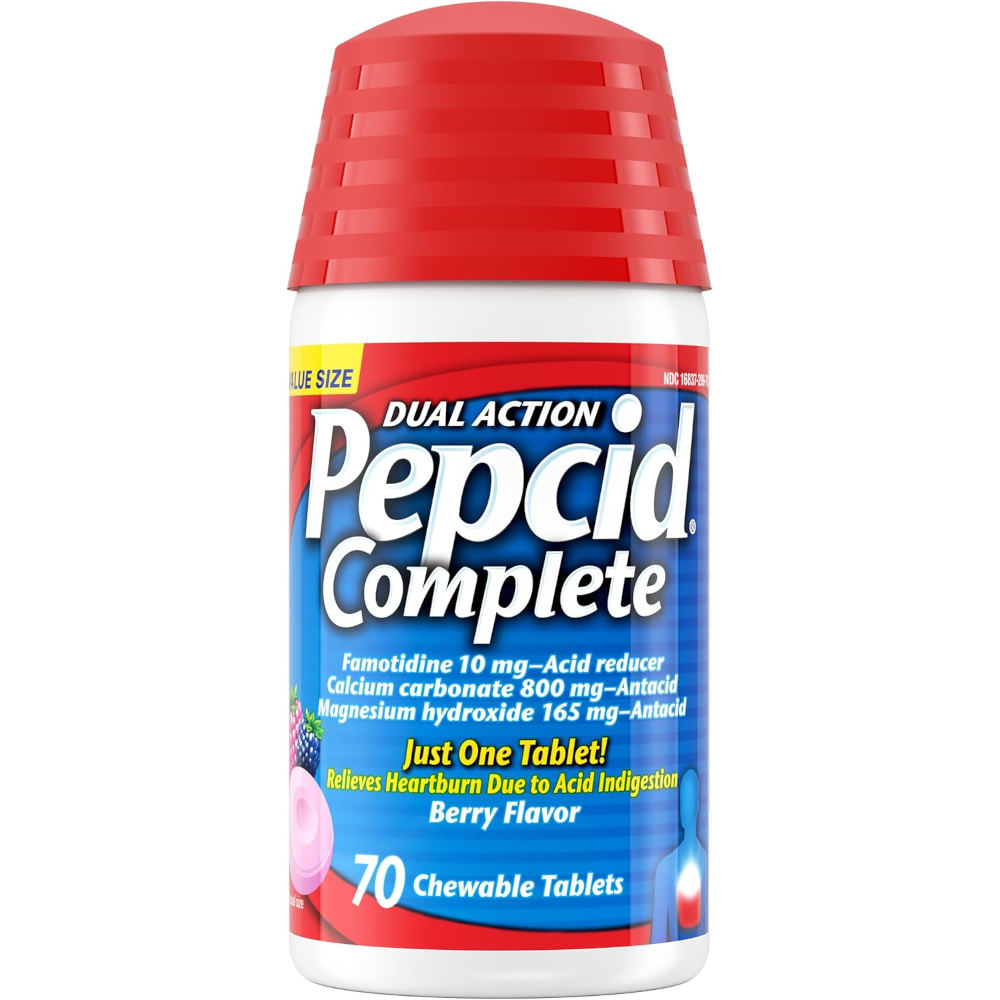 A bottle of Pepcid Complete dual action heartburn relief tablets, 70 chewable tablets, in berry flavor. The bottle has a red cap, a white plastic body, and a blue and red label with white text.